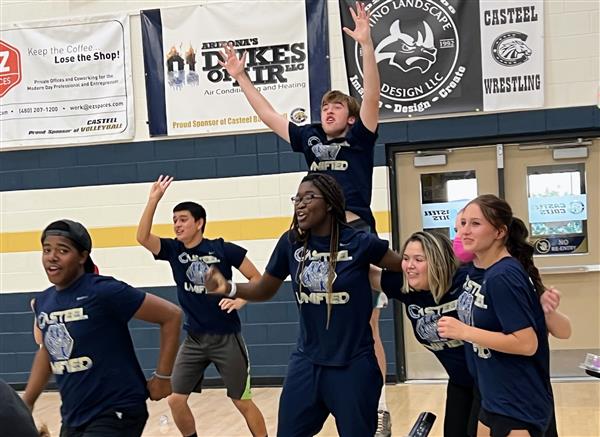 Image shows athletes celebrating after a big win!